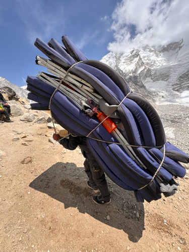 A porter in Nepal carrying a heavy load