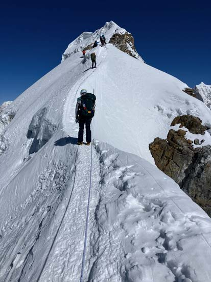 Mountaineers on a ridge of Lobuche